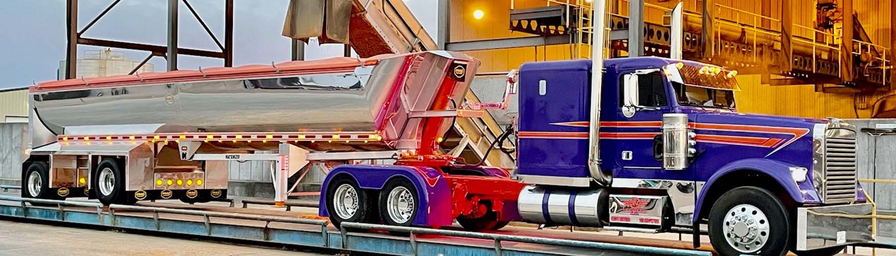 Semi and Grain Trailer Being Filled